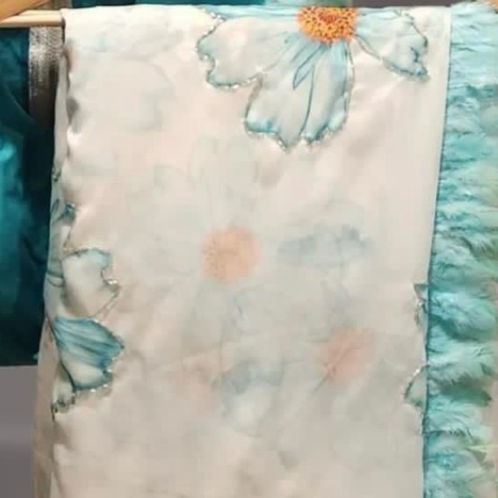 Sea blue Party wear floral print saree with feathers edges. With blouse